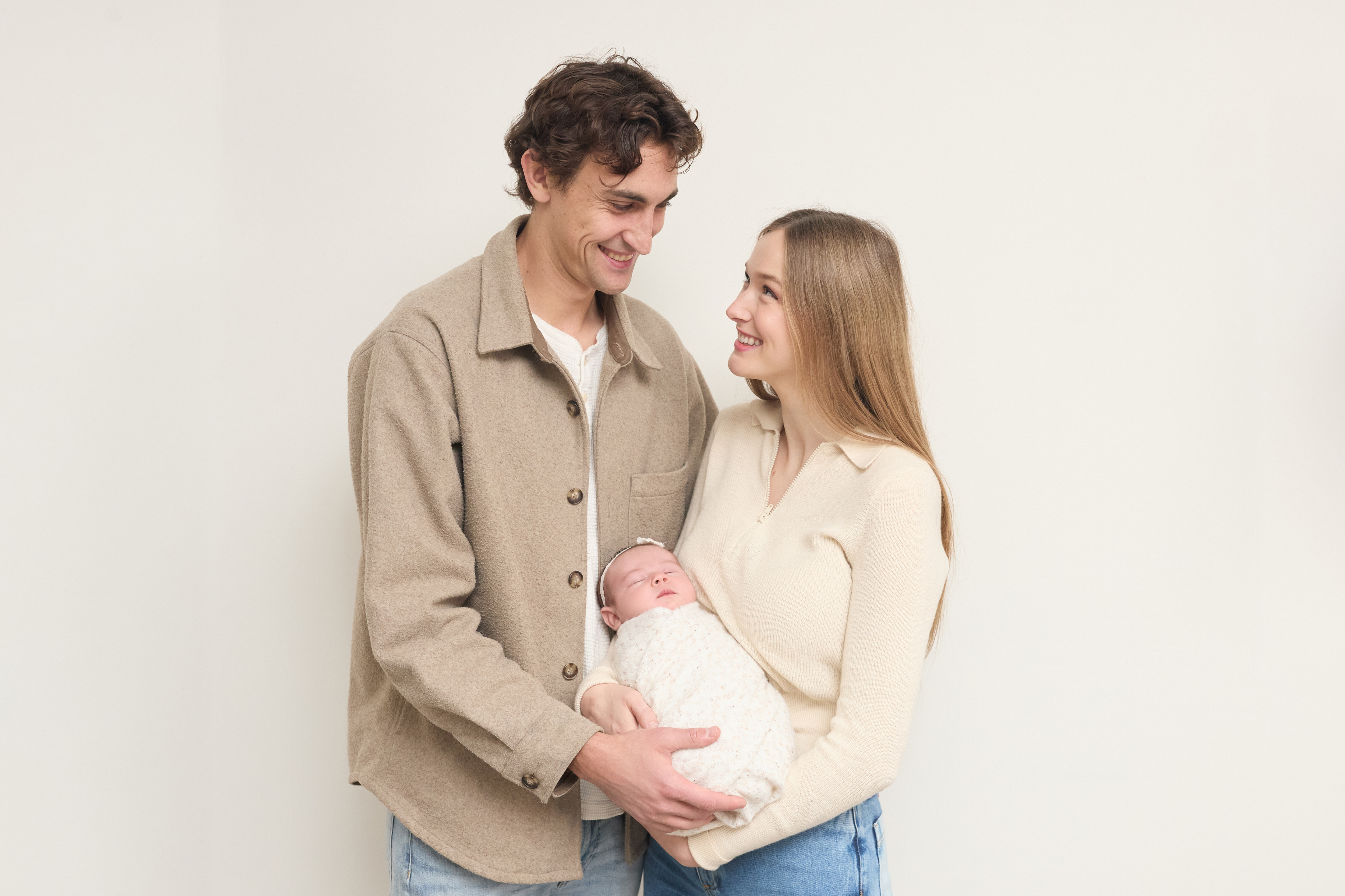 Brianna and Tristan holding their daughter Juniper